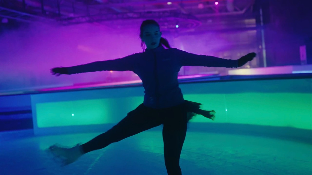 Teen girl spinning on ice